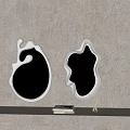Two Irregular Shaped White Mirrors On Beige Textured Wall With Books And Decor