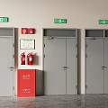 Gray Double Doors With Red Fire Safety Equipment And Green Emergency Exit Signs