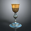 Elegant Metal Goblet With Golden Body Silver Base And Intricate Floral Carvings