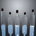 Five Transparent Glass Bottles With Red Caps And Various Shapes On Reflective Surface