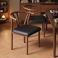 Wooden Dining Chairs With Curved Backrest And Black Leather Seats Near Table