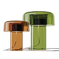 Brown and Green Floor Lamps With Dome Shaped Shades Transparent Columns and Metal Base