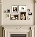 Photo Wall with Various Sized Frames and Artwork on Light Colored Wall Above Mantelpiece 3d model