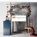 Heart Shaped Floral Art Display With Pink Flowers Greenery Blue Pedestal Lanterns And Wooden Chair