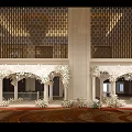 Luxurious Banquet Hall Decor With White Floral Arches And Carved Frames