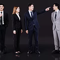 Business Professionals In Formal Suits Discussing And Pointing During Team Interaction