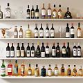 Elegant Assorted Wine Bottles and Wine Glasses Displayed on White Shelves