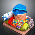 Colorful Rolled Towels Display With Blue Towel In Wooden Basket And Various Patterns On Tray