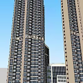 Modern High Rise Residential Building With Vertical Greenery And Glass Facade In Urban Area