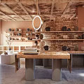 Ceramic Vessels Display In Rustic Interior With Brick Wall Wooden Shelves And Hanging Light