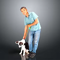 Cute black and white puppy being walked with yellow leash by man in gray background