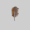 Brass Industrial Wall Sconce with Metal Cage and Glass Shade on Textured Wall