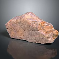Natural Reddish Brown Stone with Textured Surface Cracks and Reflection on Dark Background