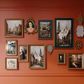 Orange Wall Decorated With Various Framed Paintings Mirrors And Ornate Decorative Items