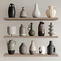 Ceramic Vessels of Various Colors and Shapes Displayed on Wooden Shelves