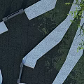 Winding White Pathways In Dark Paved Park Landscape With Green Tree Leaves