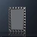 Intricate Carved Mirror Frame With Blue Glass Surface And Decorative Design