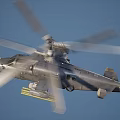 Military Helicopter With Rotors Mounted Weapons Gray Fuselage And Light Blue Nose On Ground