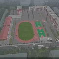 Modern School Building Complex Featuring Football Field Running Track And Green Surroundings