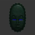 Green Decorative Mask With Textured Surface And Blue Eyes Serrated Edges