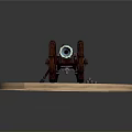 Vintage Cannon With Metal Barrel Large Wooden Wheels On Circular Stone Base And Green Grass