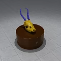 Decorative Ornament Set With Yellow Skull And Blue Horns On Brown Round Base