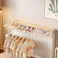Wall Mounted Clothes Rack With Children's Clothes Shoes Slippers And Light Colored Wall