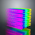 Colorful Spiral Multi layered Doll Toy With Reflective Surface And Shiny Rainbow Design