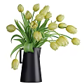 Beautiful Yellow Tulips In Black Pitcher Vase With Fresh Green Leaves