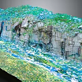 Garden Landscape With Layered Rocky Cliffs Green Vegetation And Flowing Water