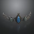 Ornate Metal Decorative Ornament With Blue Gemstone Green Stones And Vine Design