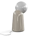 Elegant Contemporary Table Lamp Featuring Spherical Glass Shade And Sleek Transparent Base Design
