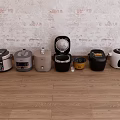 Various Kitchen Appliances In Different Styles And Colors On Wooden Floor