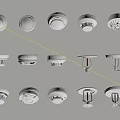 Various Types of White Safety Devices Including Smoke Detectors and Alarms Arranged on Beige Background