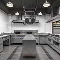 Modern Commercial Kitchen With Stainless Steel Equipment Central Island And Hanging Cookware