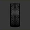 Black Tire With Detailed Tread Pattern And Stylish Wheel Rim Red Accents
