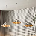 Modern Three Pendant Lights With Golden White Shade Over Perforated Wall And Green Plant Curtain