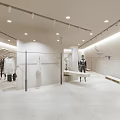 Modern Fashion Clothing Store Interior With Mirrors Plants And Display Area