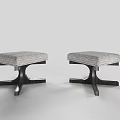 Two Modern Stools With Gray Upholstered Seats And Black Wooden Legs
