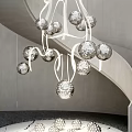 Silver Spherical Chandelier Hanging Beside Spiral Staircase With Gray Wall and Scattered Spherical Ornaments