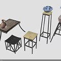 Rustic Wooden Table With Black Frame Stools And Pedestals With Vases And Blue Flowers