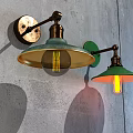 Vintage Industrial Wall Lamps with Green Glass Shades and Brass Arms Mounted on Gray Wall