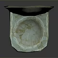 Golden Statue In Shell Shaped Marble Container With White And Brown Patterns