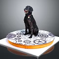 Black dog with red collar sits on round platform with gear patterns and orange edge