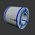 Silver Metal Coil Wrapped With Blue Tape And Product Labels For Industry Use