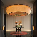 Hotel Lobby Featuring Circular Floral Pattern Ceiling Light Fixture Striped Walls And Flower Arrangements