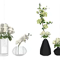 White Flowers In Textured And Geometric Vases Featuring Roses Orchid And Small Blooms