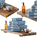 Soft Blue Bathroom Set With Stacked Towels Wooden Tray Soap And Perfume Bottle