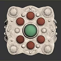 Silver Ring Featuring Central Green Gemstone with Red Gemstones and Decorative Pearl like Dots