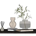 Decorative Ornament Combination With Reed Diffuser Brown Ceramic Clear Glass Vases Greenery And Stacked Books
